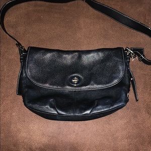 Coach Black Flap top convertible duffel.